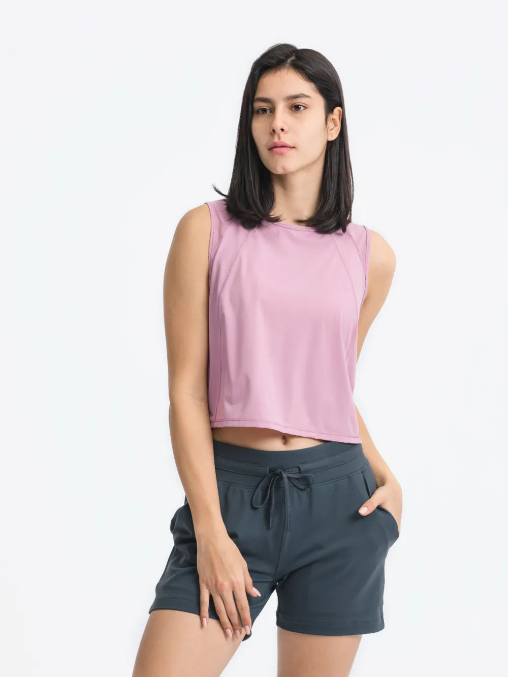 Side view of Millennia Cropped Active Tank in pink – Voguelle