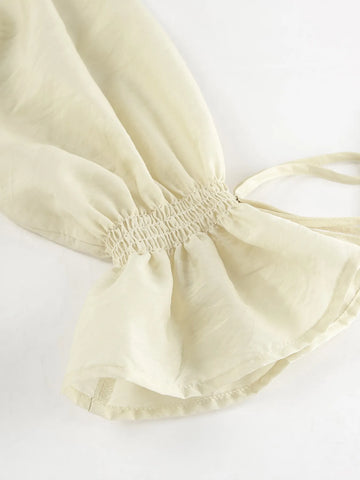 Front angle of cream two-piece ruffle blouse and shorts set – Voguelle