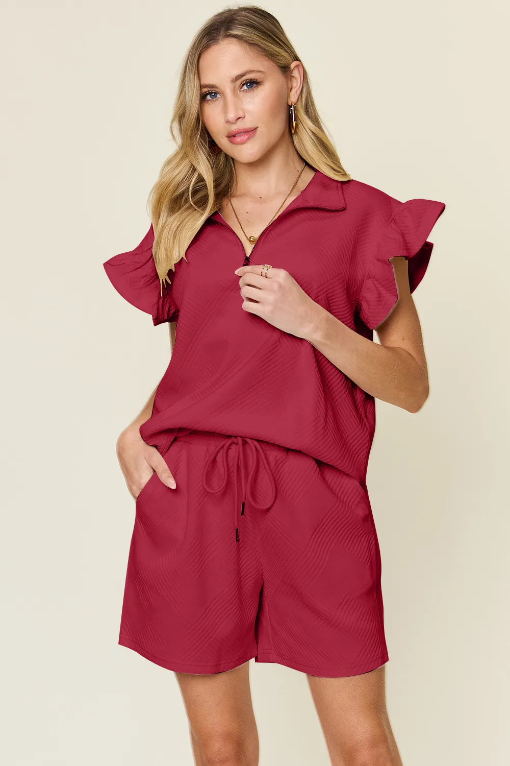 Cream flounce sleeve top tucked into drawstring shorts – Voguelle