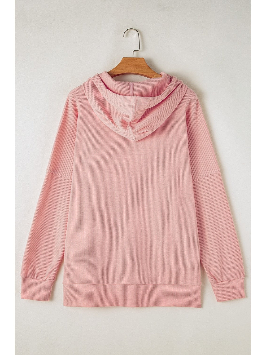 V-neck hooded waffle-knit pullover in gray on model – Voguelle