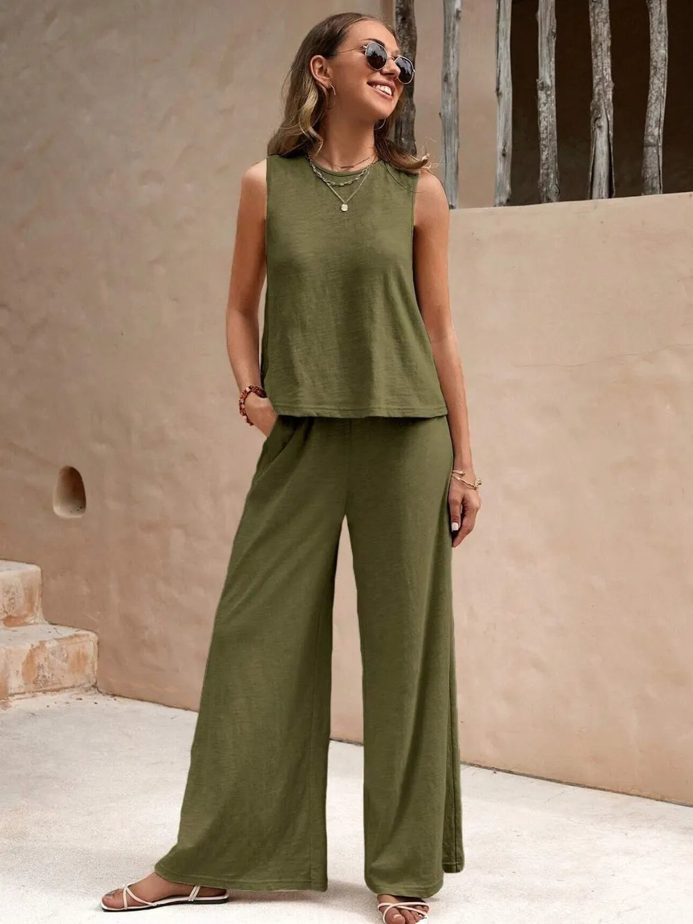 Beige sleeveless top tucked with wide leg trousers – Voguelle