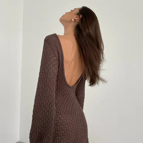 Model posing in knit hollow-out maxi dress – Voguelle