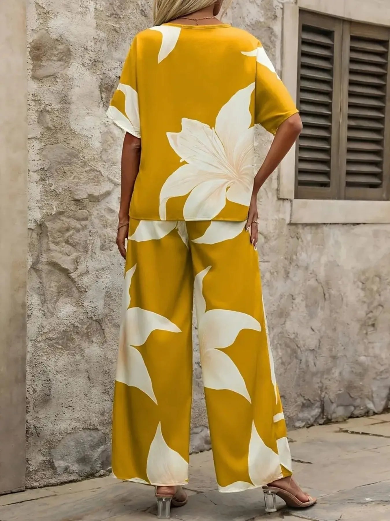 Lifestyle view of Printed Floral V-Neck Top and Pants Outfit – Voguelle