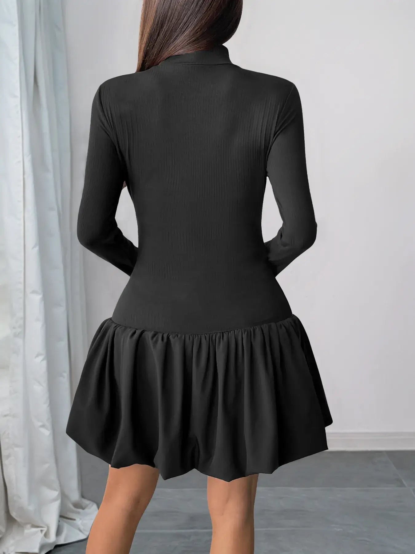 Black mock neck bubble hem dress back view – Voguelle