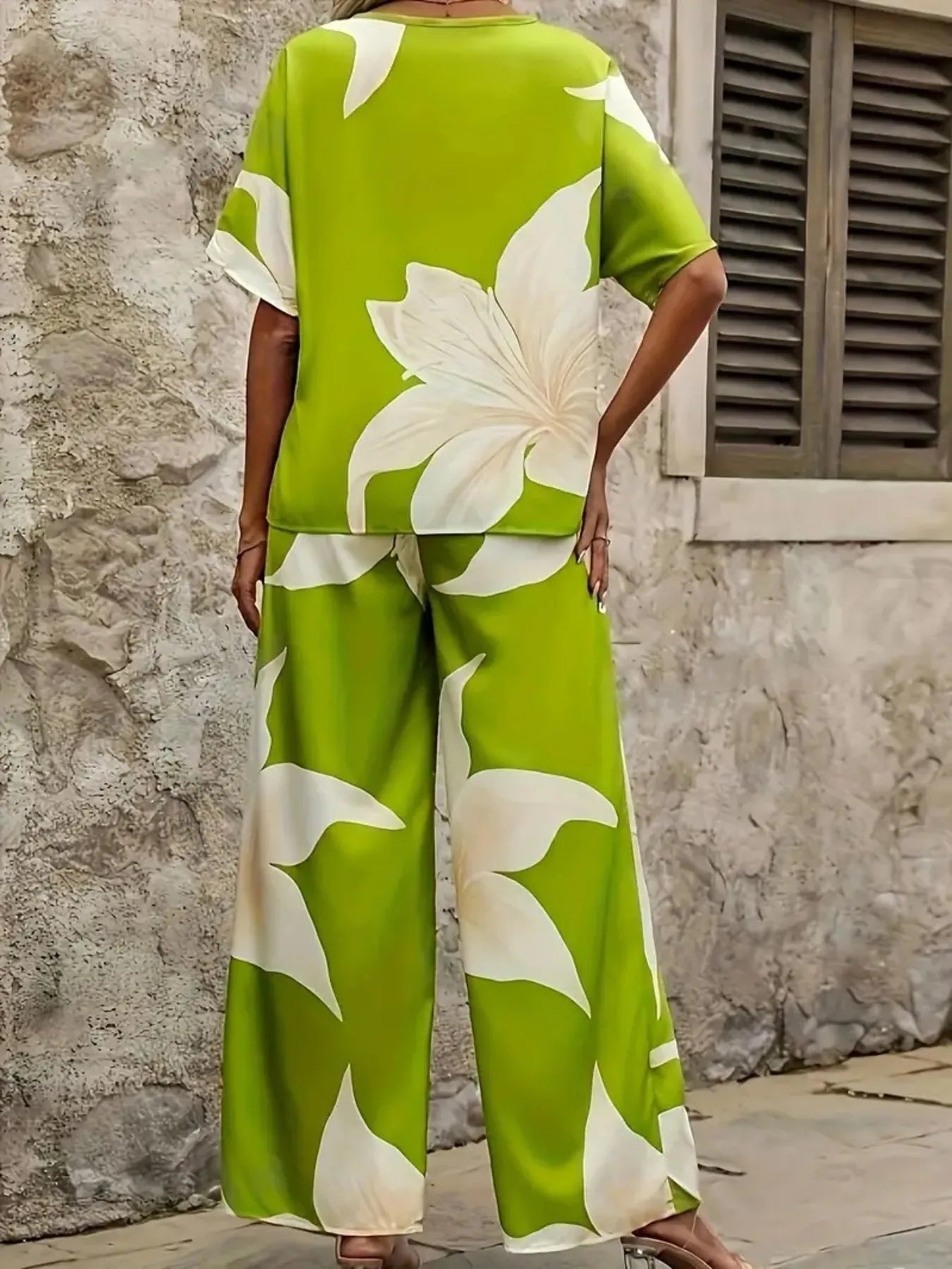 Model wearing Printed V-Neck Floral Top & Pants Set in casual pose – Voguelle