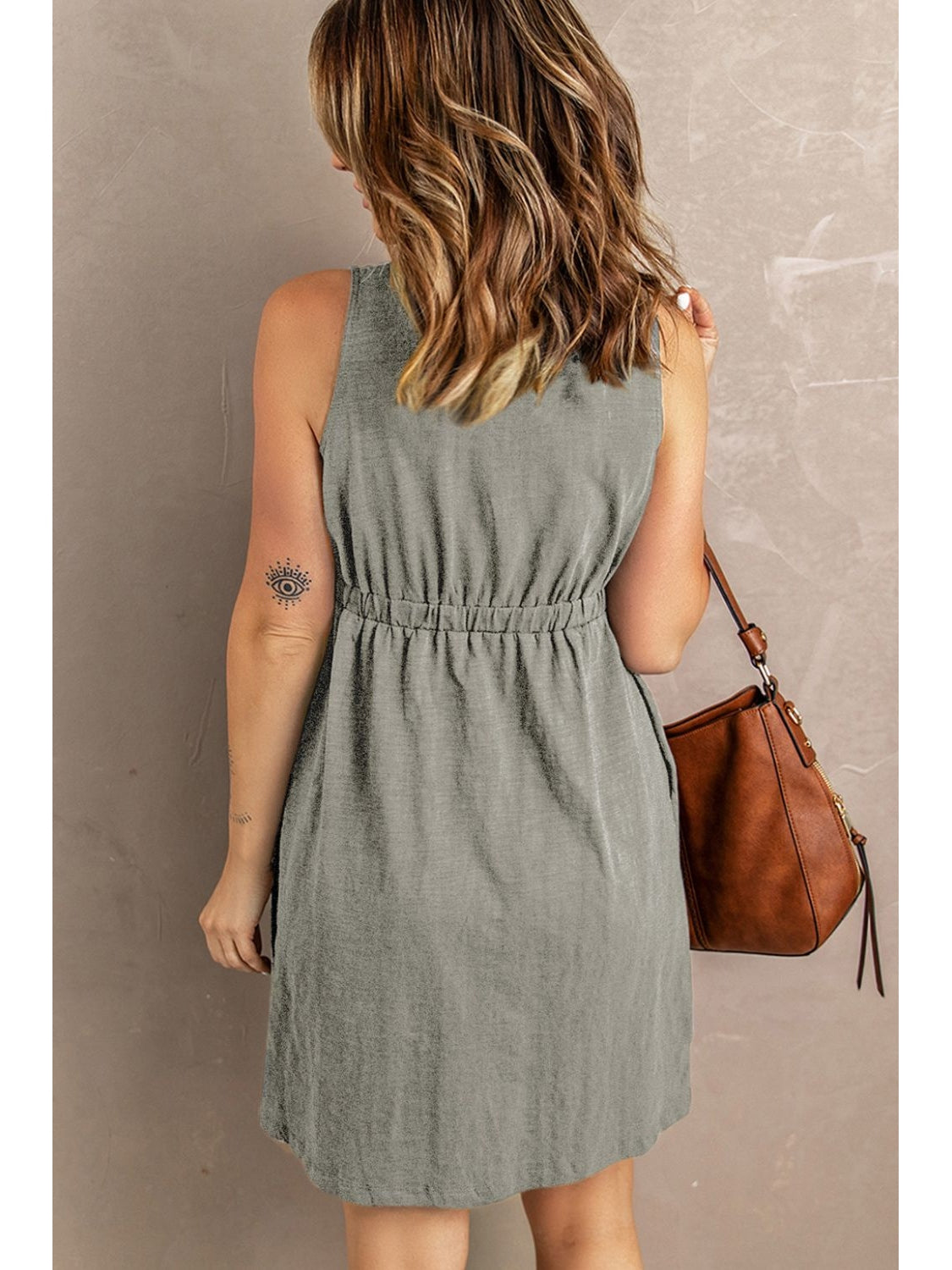 Overhead angle of black sleeveless button down mini dress – Voguelle