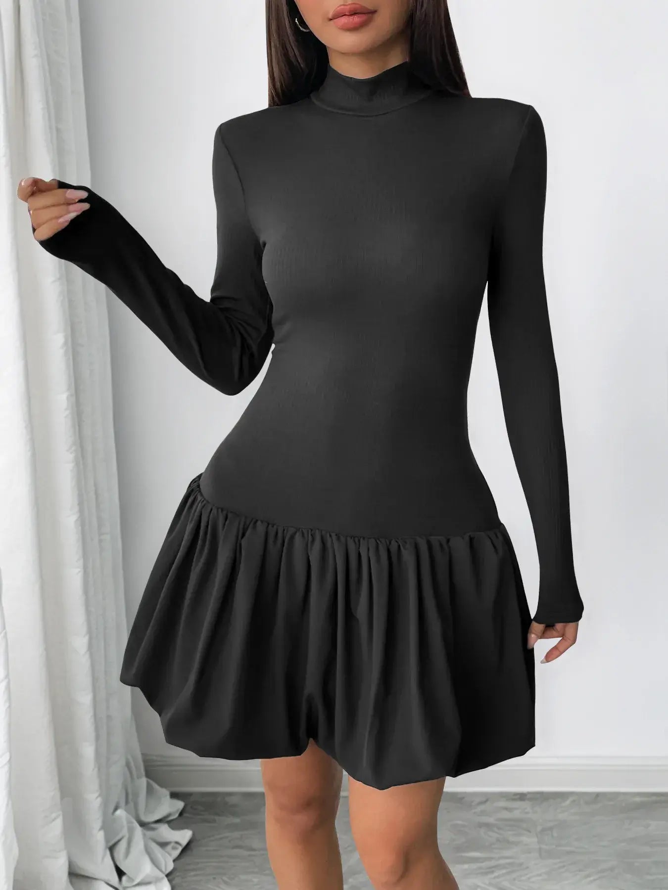 Black bubble hem dress twirl pose – Voguelle