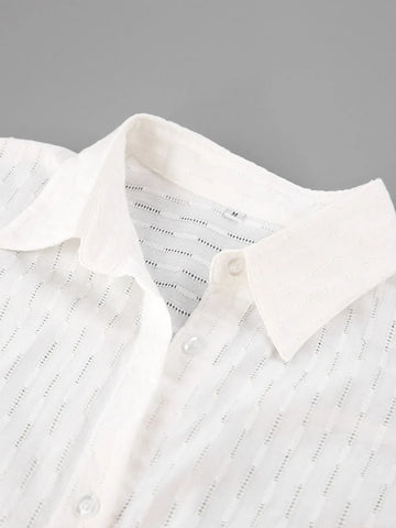Detail of button front and cuff on textured marigold shirt – Voguelle