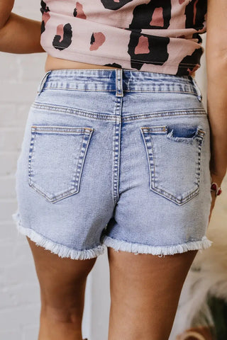 Back view of high-waisted pearl studded denim shorts – Voguelle