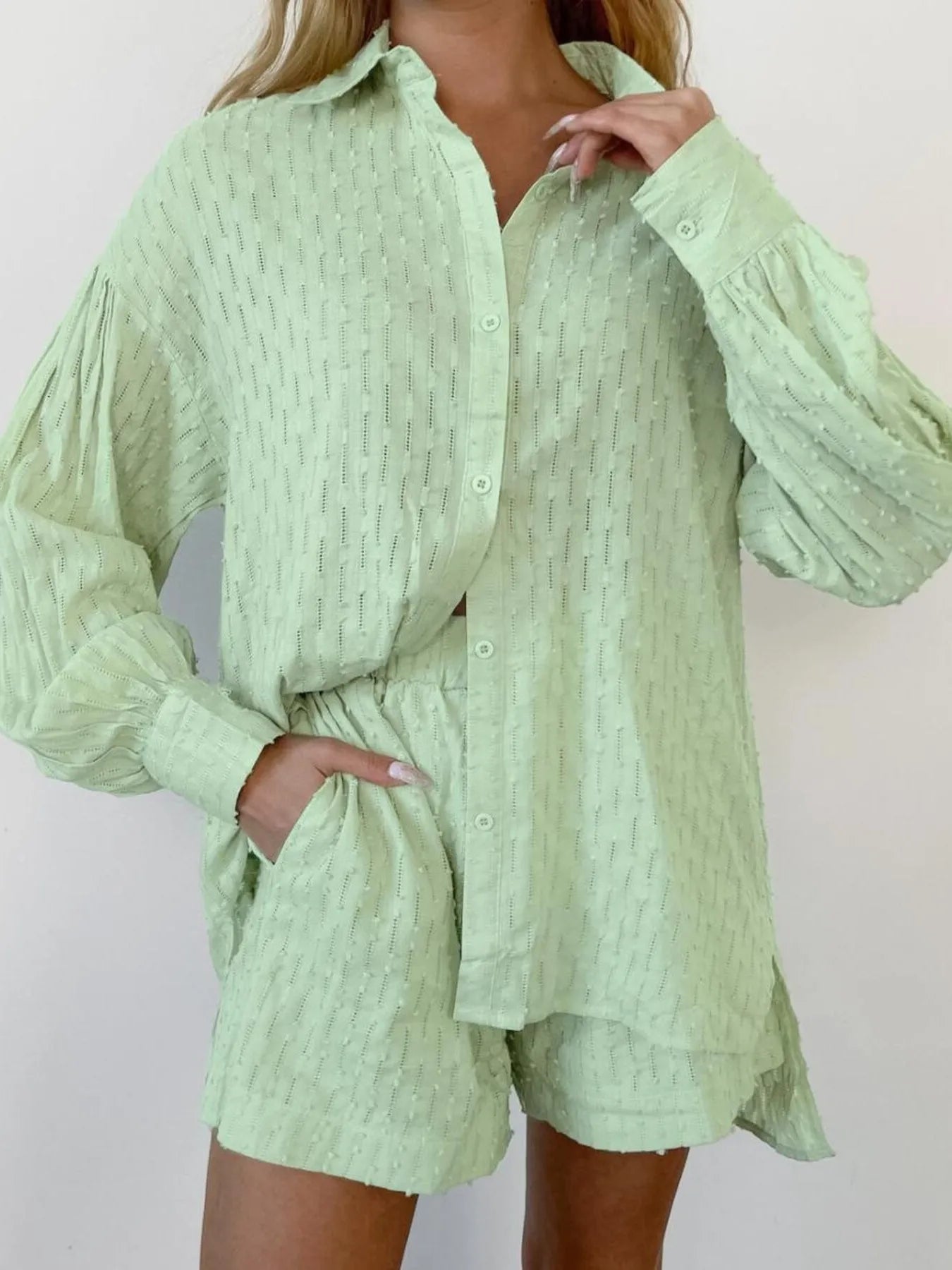 Model styling marigold textured shirt half-tucked into shorts – Voguelle