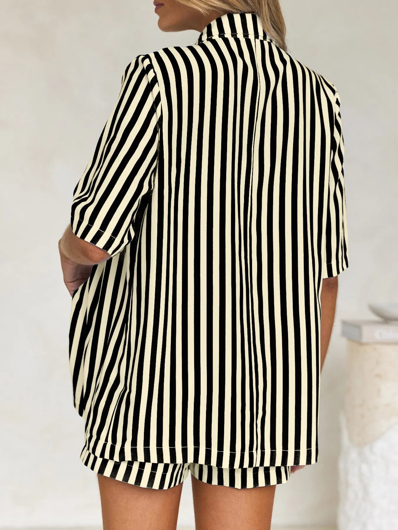 Detail of striped button-up shirt with pocket and coordinating shorts – Voguelle