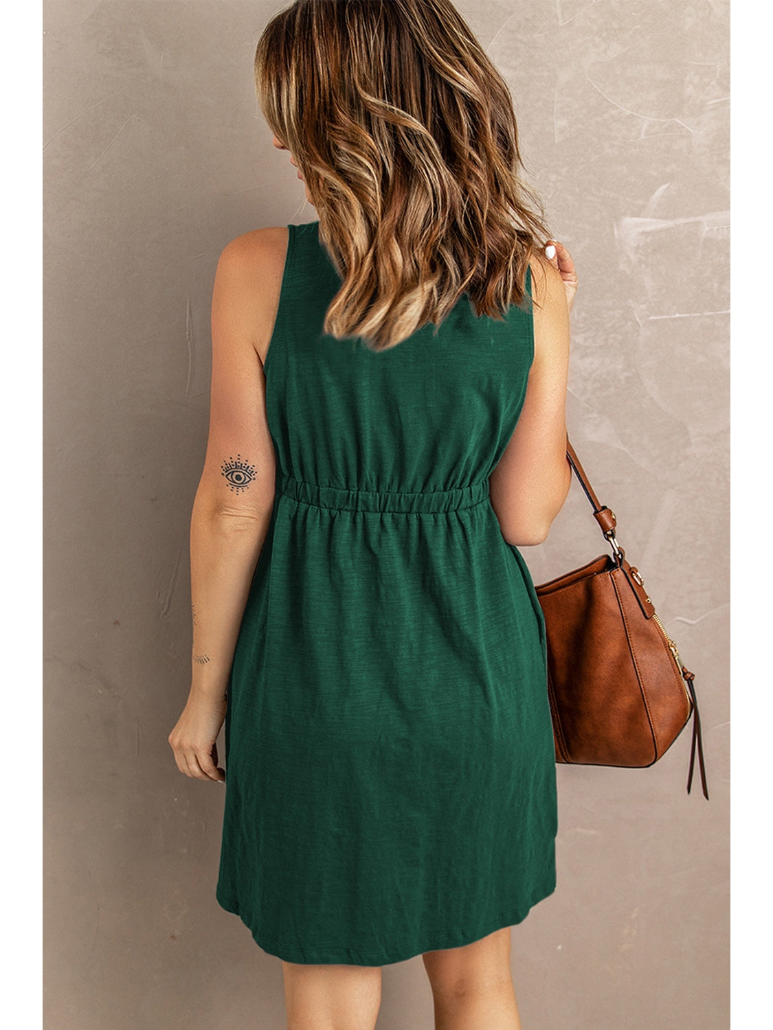 Lifestyle image of black sleeveless button down casual dress – Voguelle