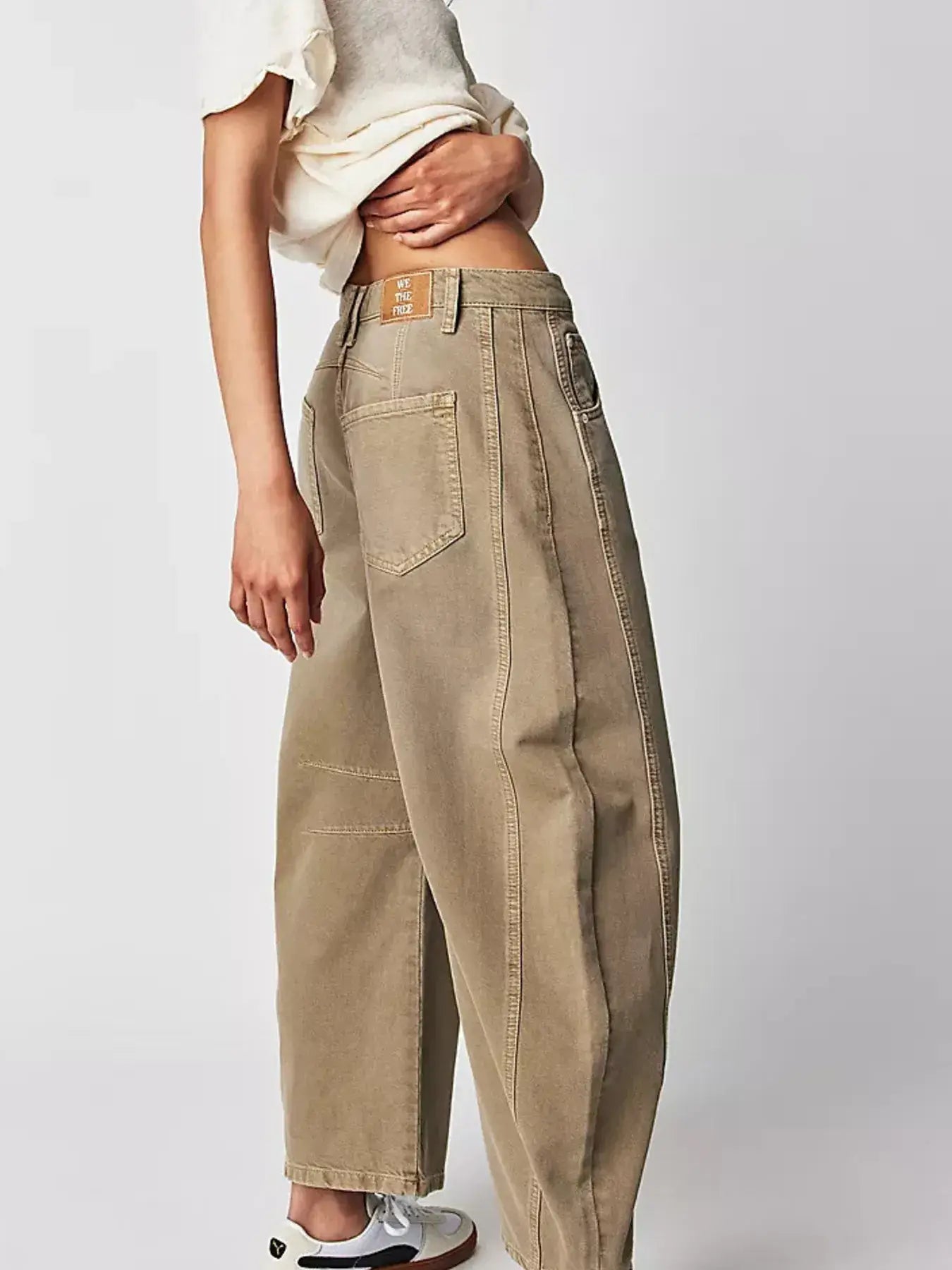 Side angle of high-waisted wide leg beige jeans – Voguelle