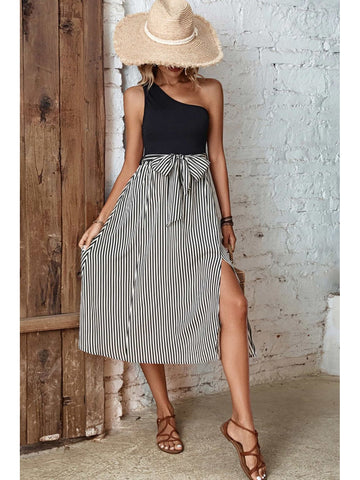 Lifestyle image of model sitting in striped one-shoulder slit dress – Voguelle
