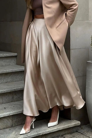 Front view of model wearing champagne satin midi skirt with blazer and heels – Voguelle