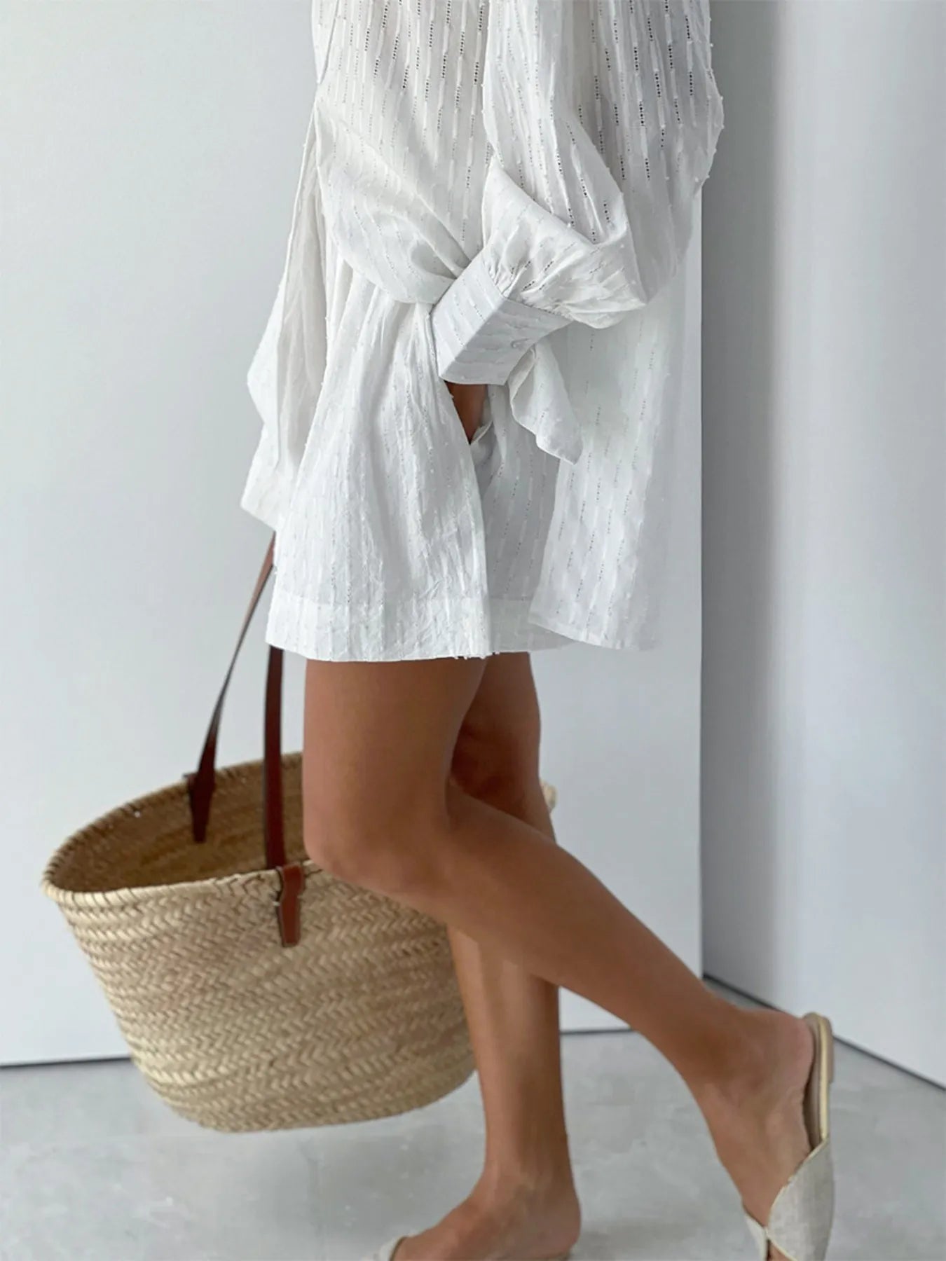 Side profile of model in chic textured two-piece summer set – Voguelle