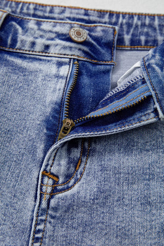 Close-up of pearl embellishment on denim shorts – Voguelle