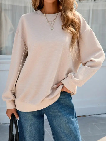 Front view of Striped Patchwork Long Sleeve Sweatshirt in beige on model – Voguelle