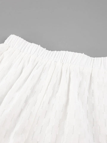 Model styling white textured button-up shirt casually – Voguelle