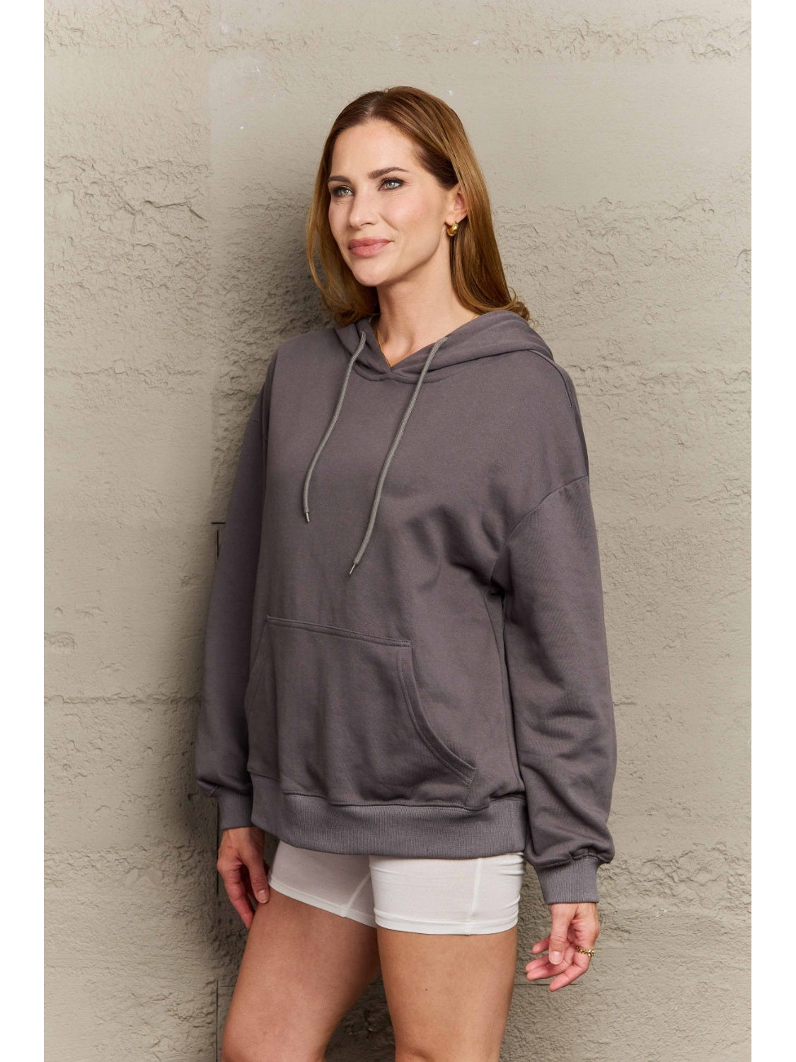 Model styled in oversized camel hoodie – Voguelle
