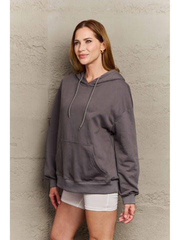 Model styled in oversized camel hoodie – Voguelle