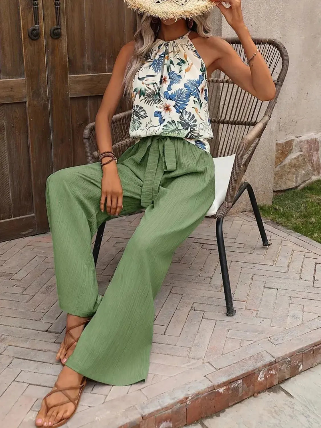 Printed floral blouse tucked into wide leg green pants – Voguelle