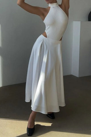 Side view of white satin midi skirt on model, showing flowy silhouette – Voguelle