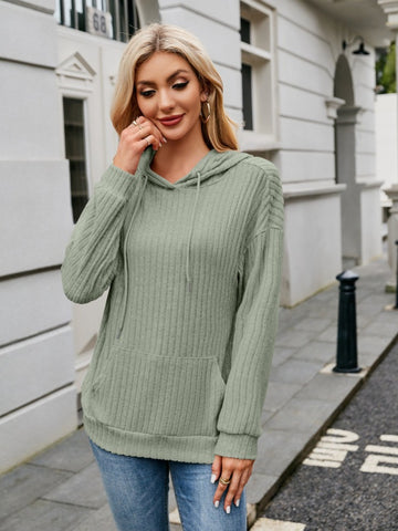 Close-up of ribbed beige hoodie sleeve detail – Voguelle