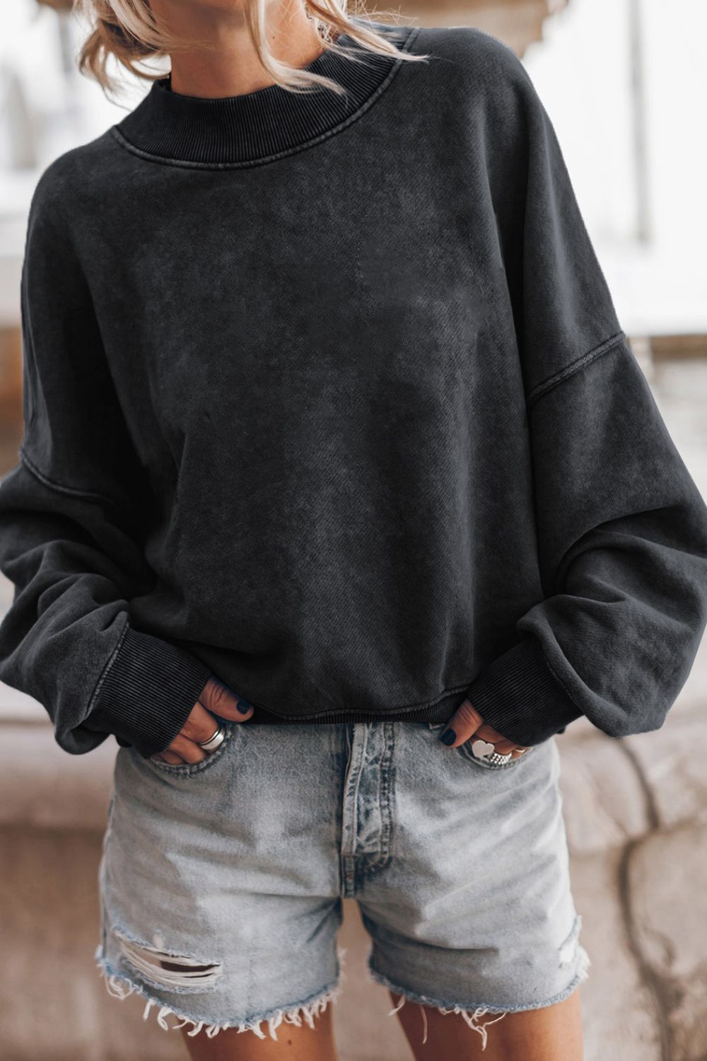 Model outdoors in green sweatshirt – Voguelle