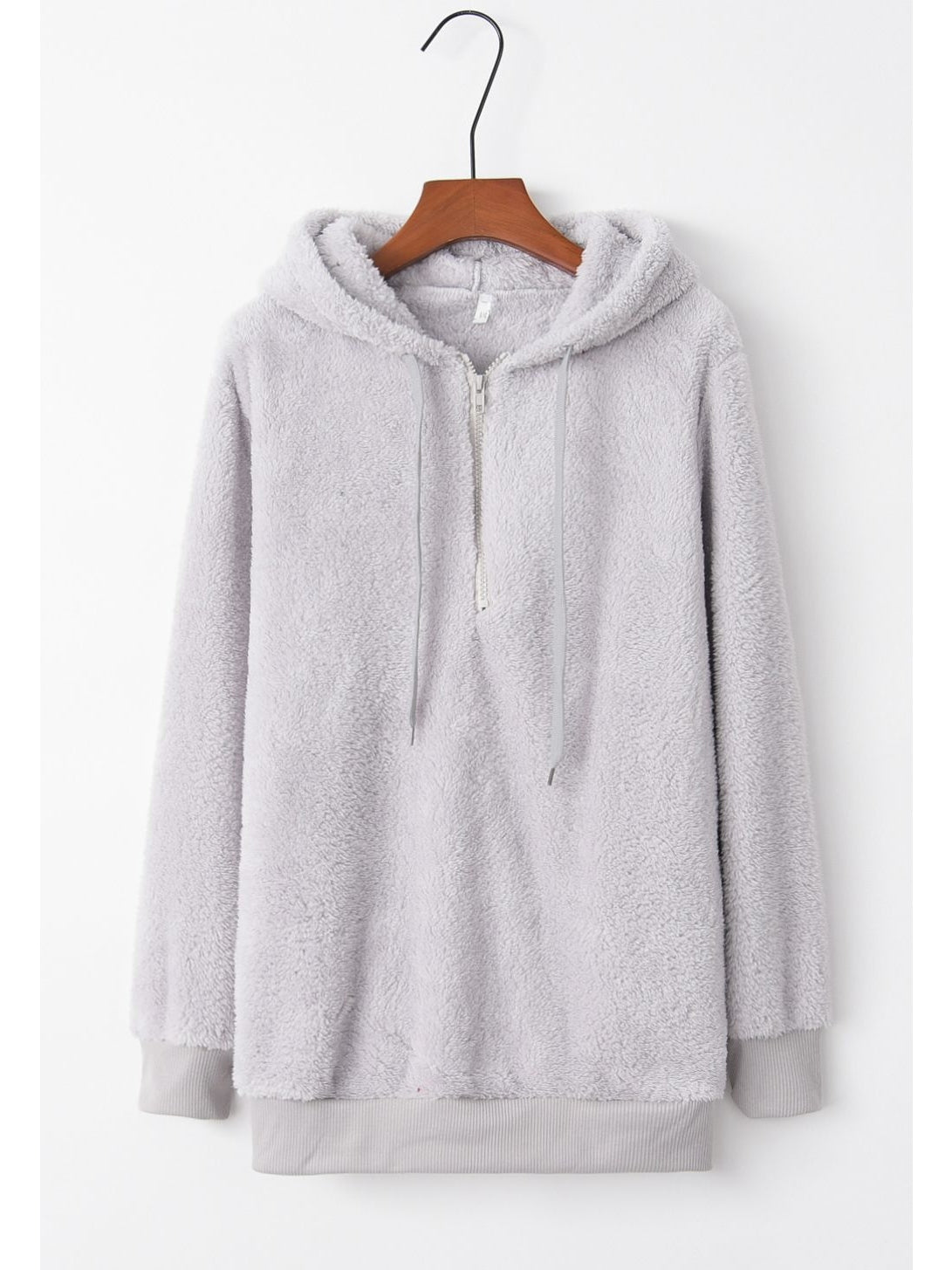Side profile of model wearing teddy hoodie in brown – Voguelle
