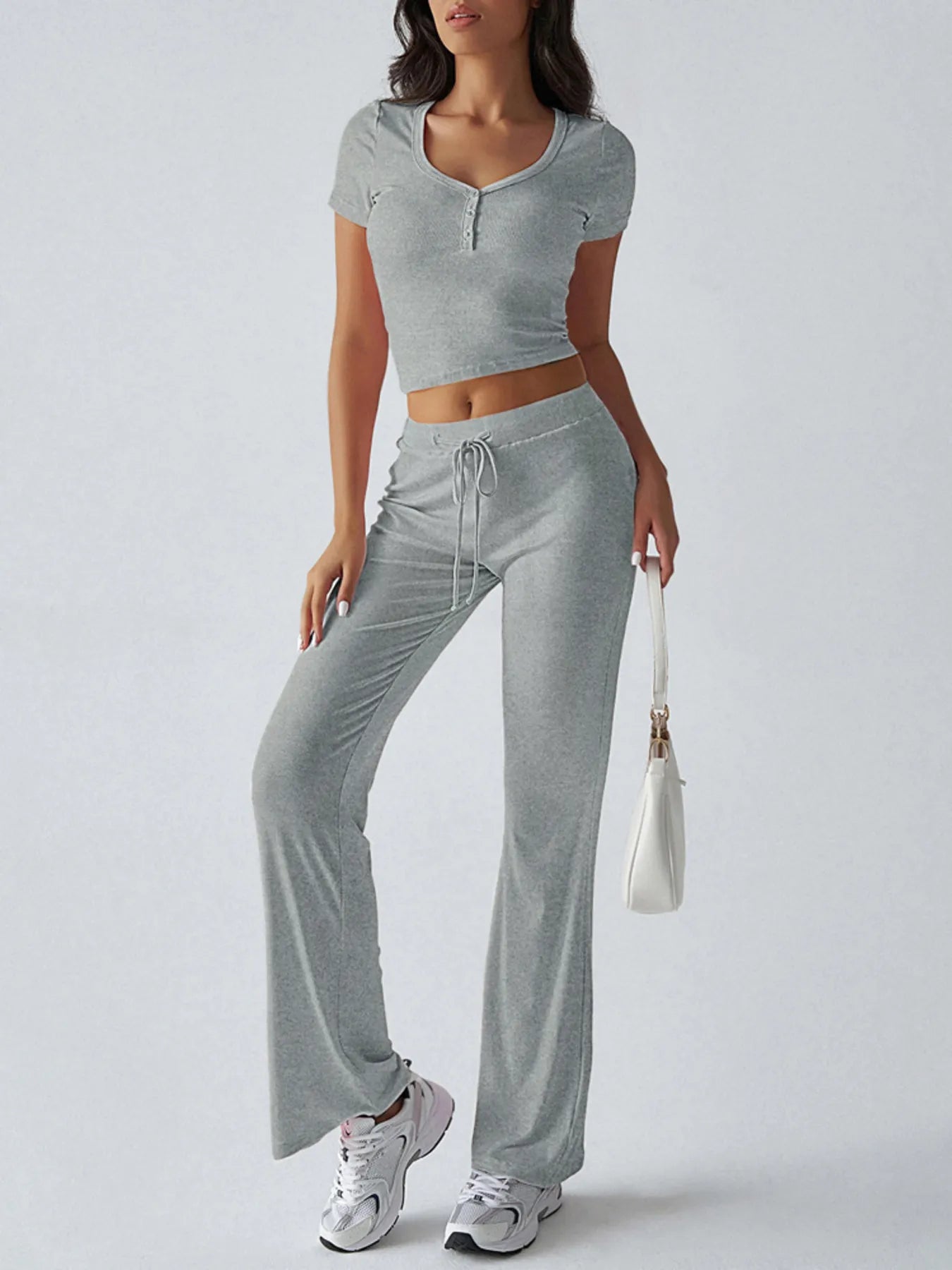 Ribbed crop top with pink flared pants styled casually – Voguelle