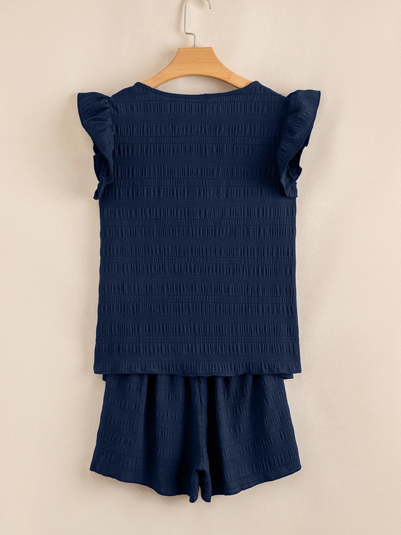 Back view of navy ruffled sleeve crop top and high waist shorts – Voguelle