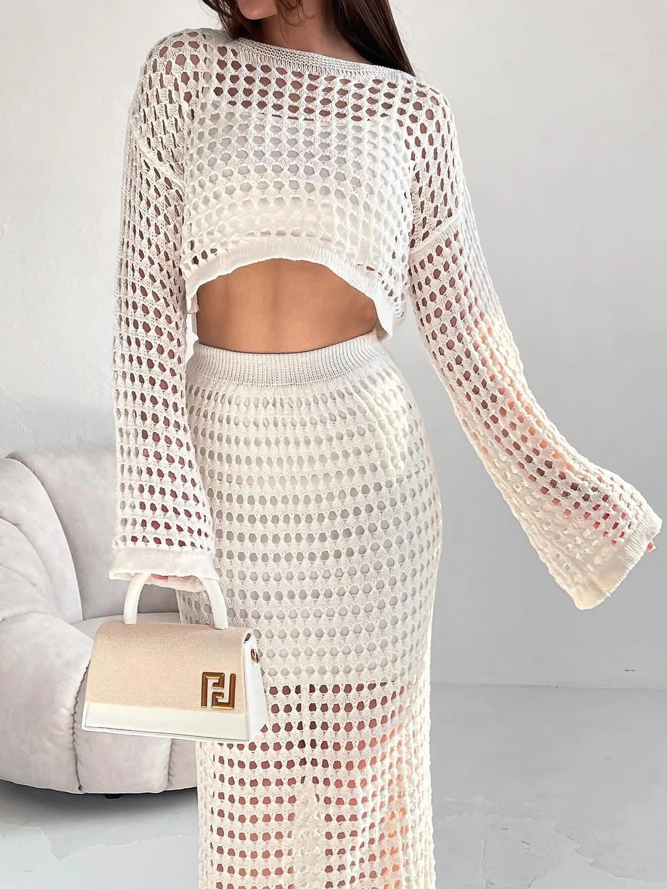 Back detail of hollow out knit two-piece crop top and maxi skirt – Voguelle