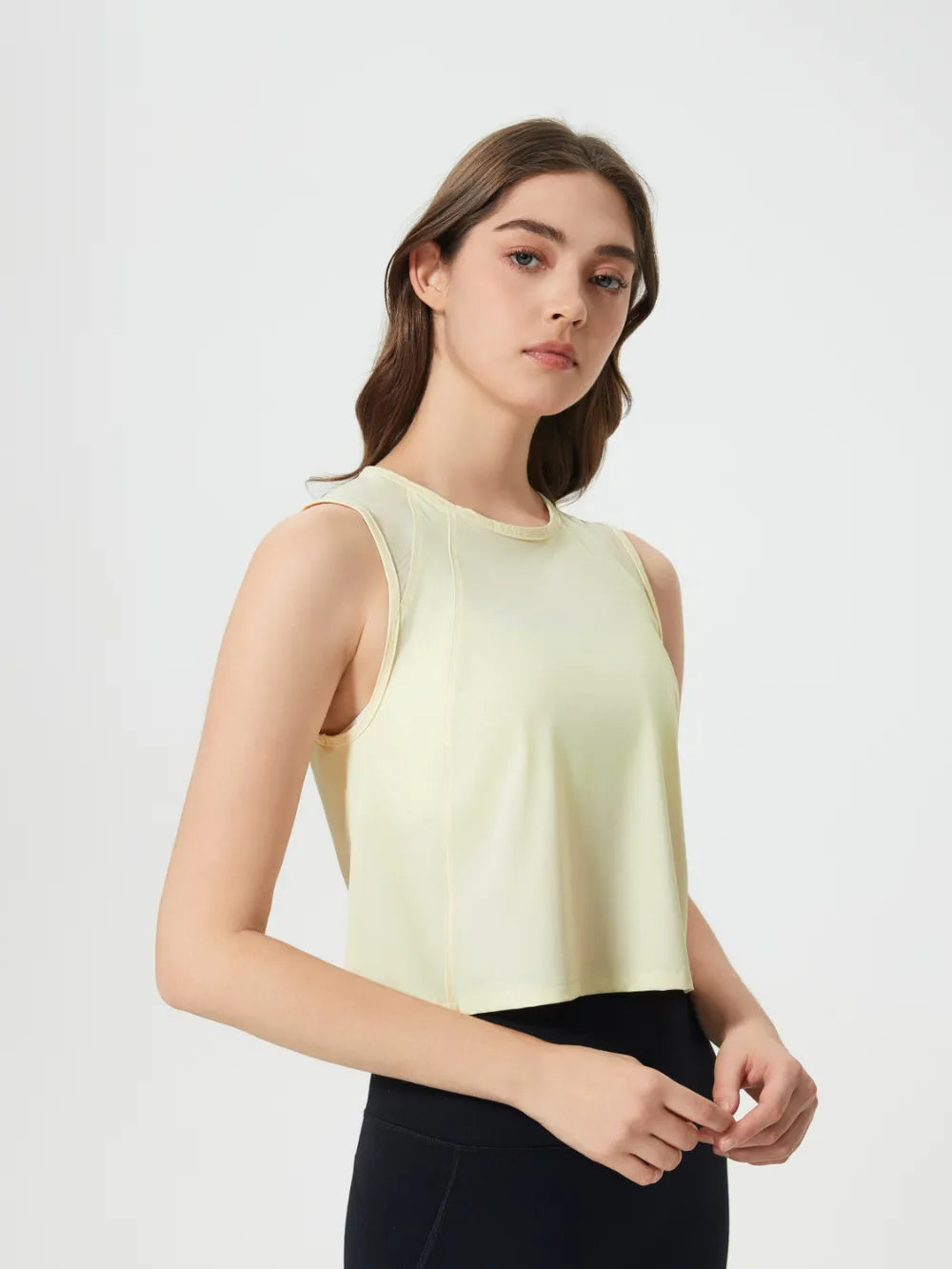 Side angle of Millennia Cropped Active Tank in gray – Voguelle