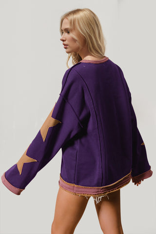 Side view of star patched green sweatshirt – Voguelle