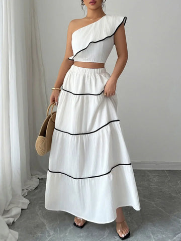 Close-up of cropped one-shoulder ruffle top with black trim – Voguelle