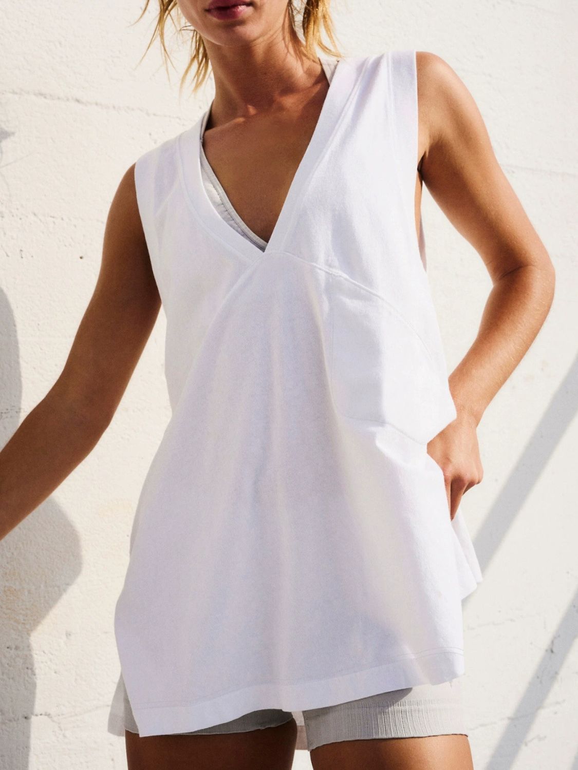 Close-up neckline detail of V-neck tank top – Voguelle