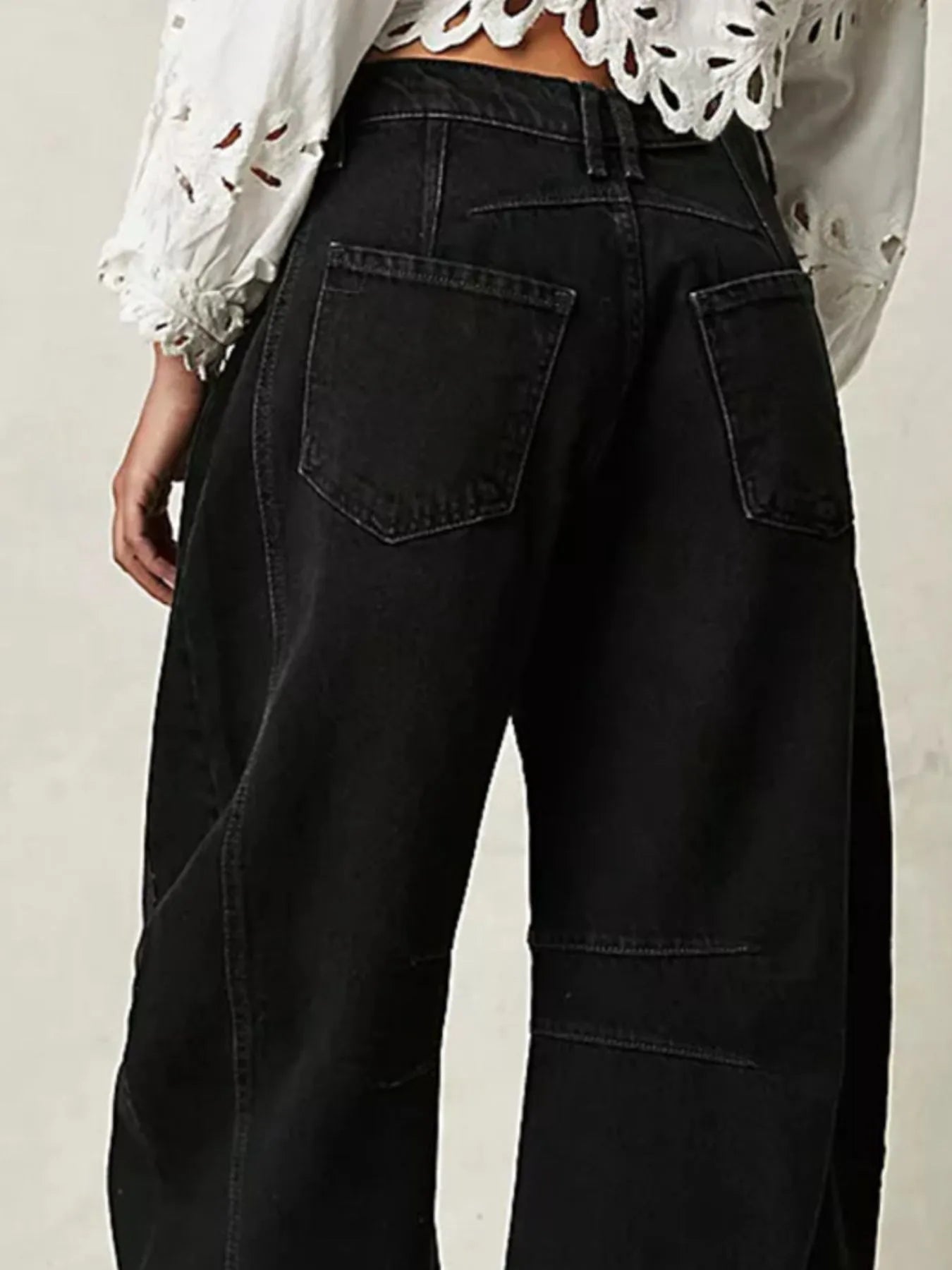 Back pocket detail of black wide leg jeans – Voguelle