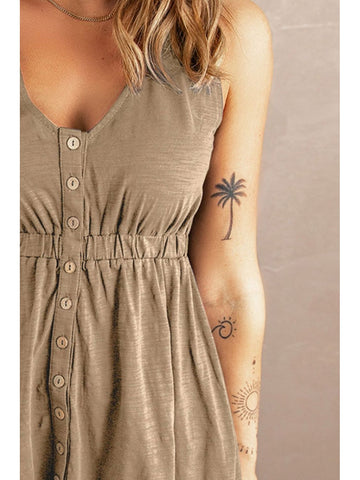 Sunlit lifestyle shot of sleeveless black button down dress – Voguelle