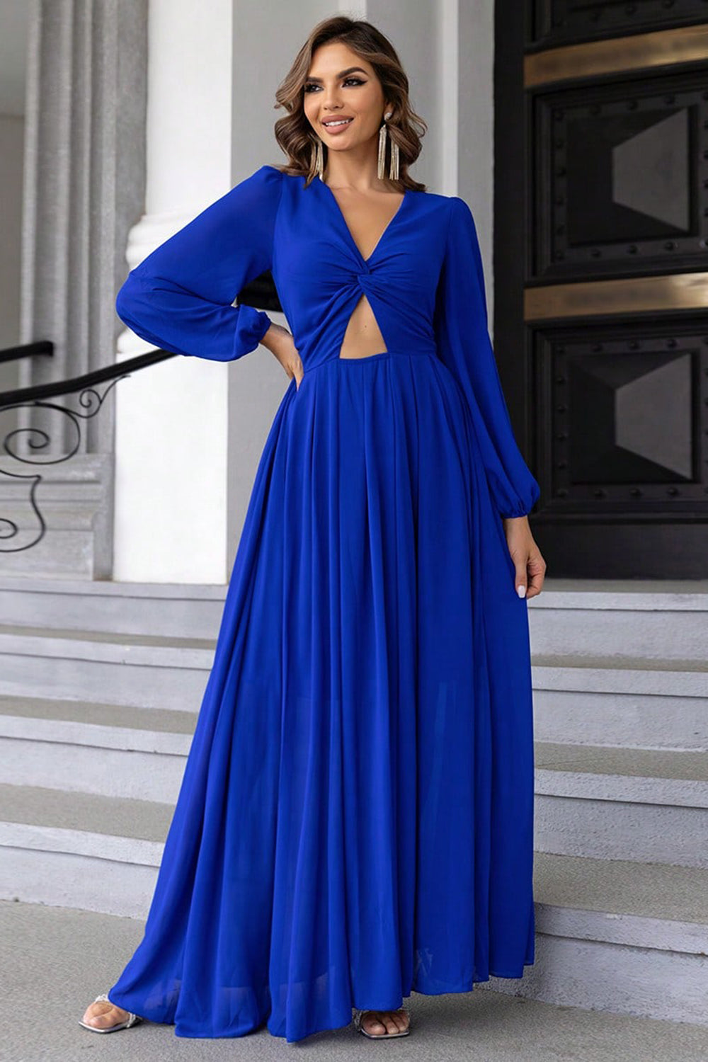 Chic blue twist front cutout evening dress styled on model – Voguelle