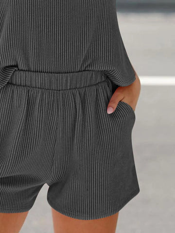 Pink ribbed fabric close-up of women’s two-piece outfit – Voguelle
