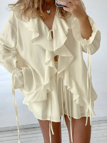 Side view of Ruffled V-Neck Top with long sleeves and tie waist – Voguelle