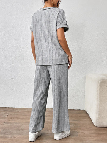 Model seated wearing gray ribbed short sleeve lounge set – Voguelle