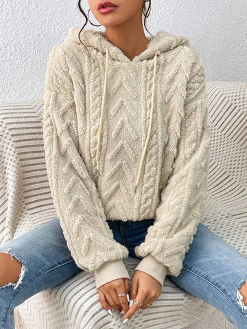 Close-up of beige fleece hoodie with chevron texture – Voguelle