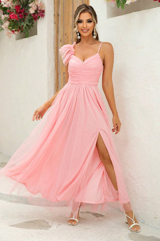 Model posing in ruched slit maxi dress with asymmetrical shoulder – Voguelle