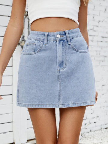 Model wearing light blue solid mini denim skirt with white top, full outfit – Voguelle