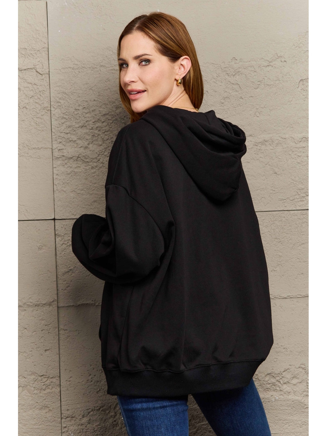 Oversized fit hoodie in camel shown from side view – Voguelle