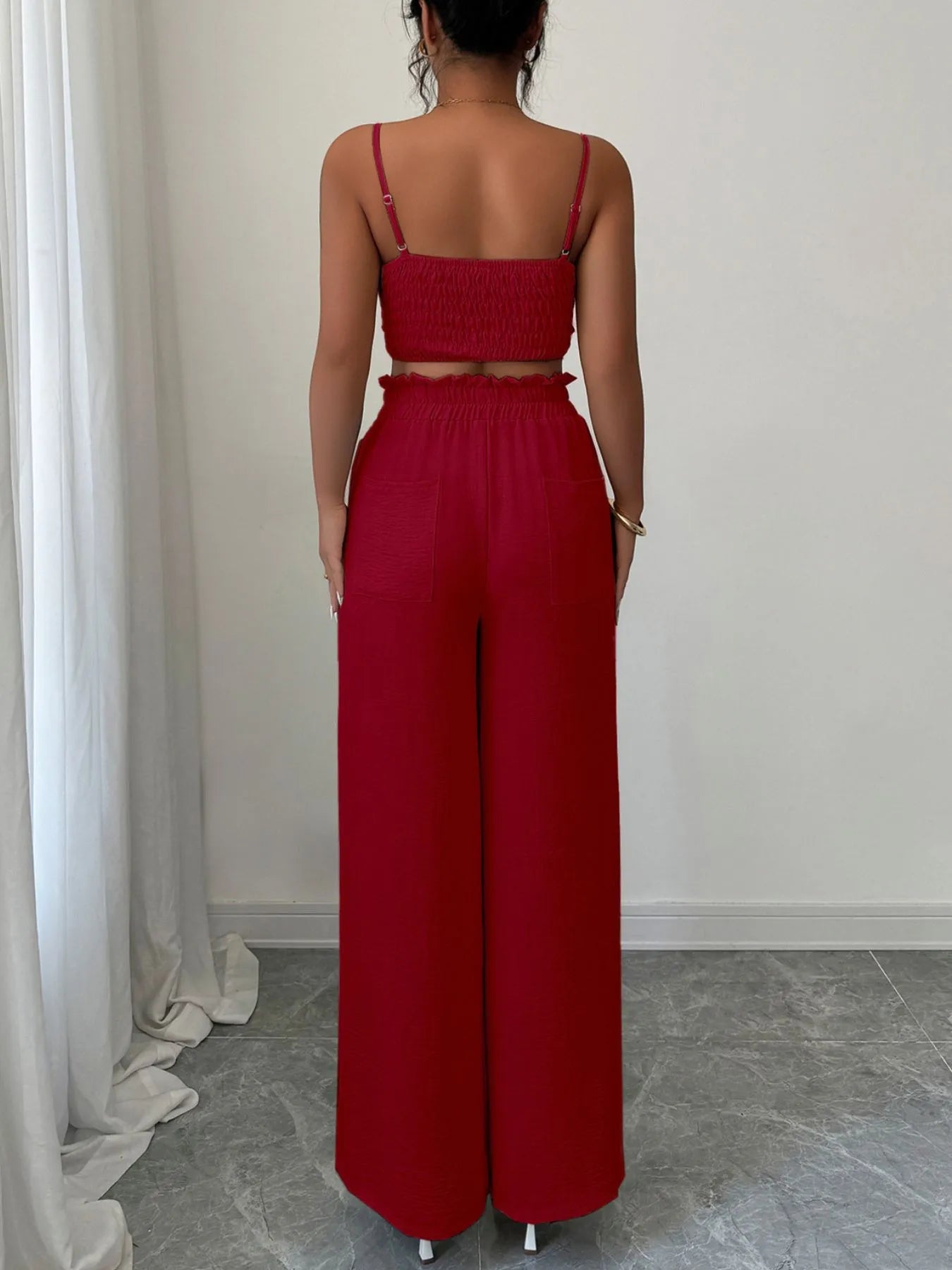 Front view of green V-neck crop cami top with wide leg pants on model – Voguelle