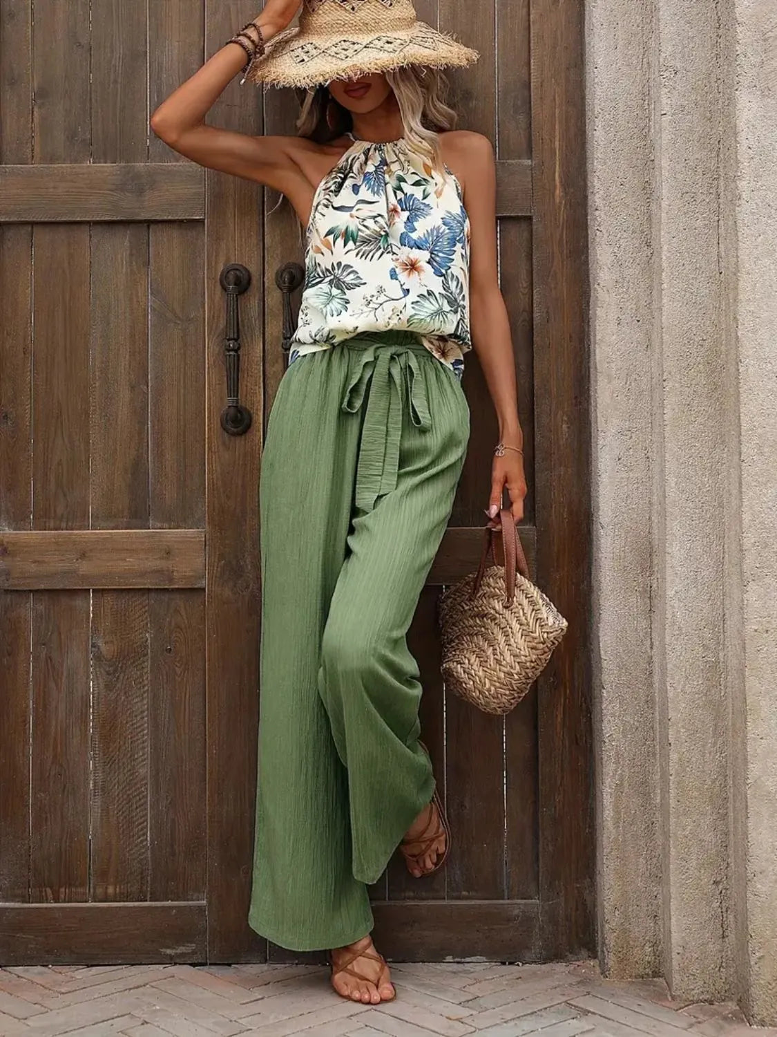Printed floral blouse tucked into wide leg green pants – Voguelle