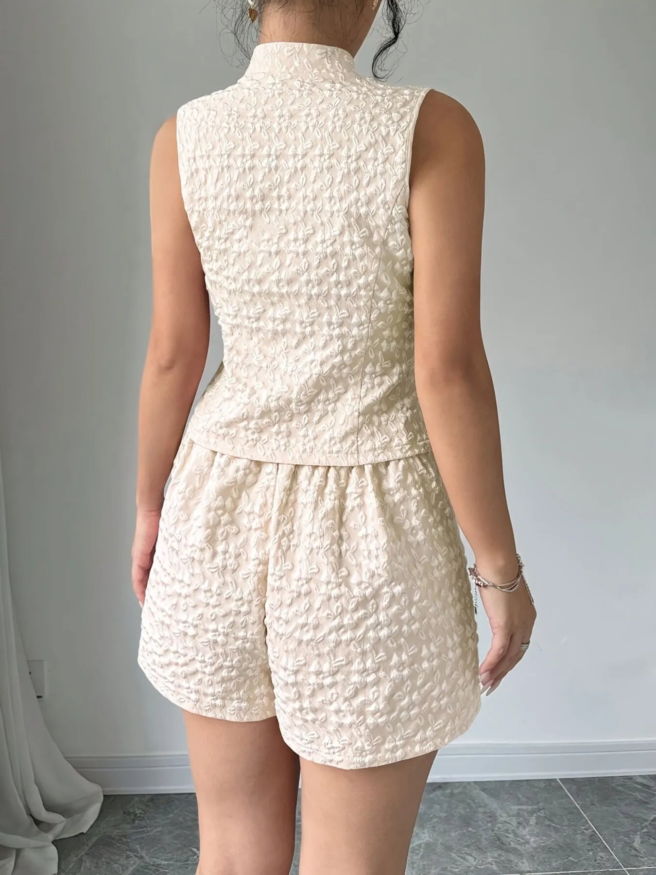 Back view cream button-up vest with matching shorts – Voguelle